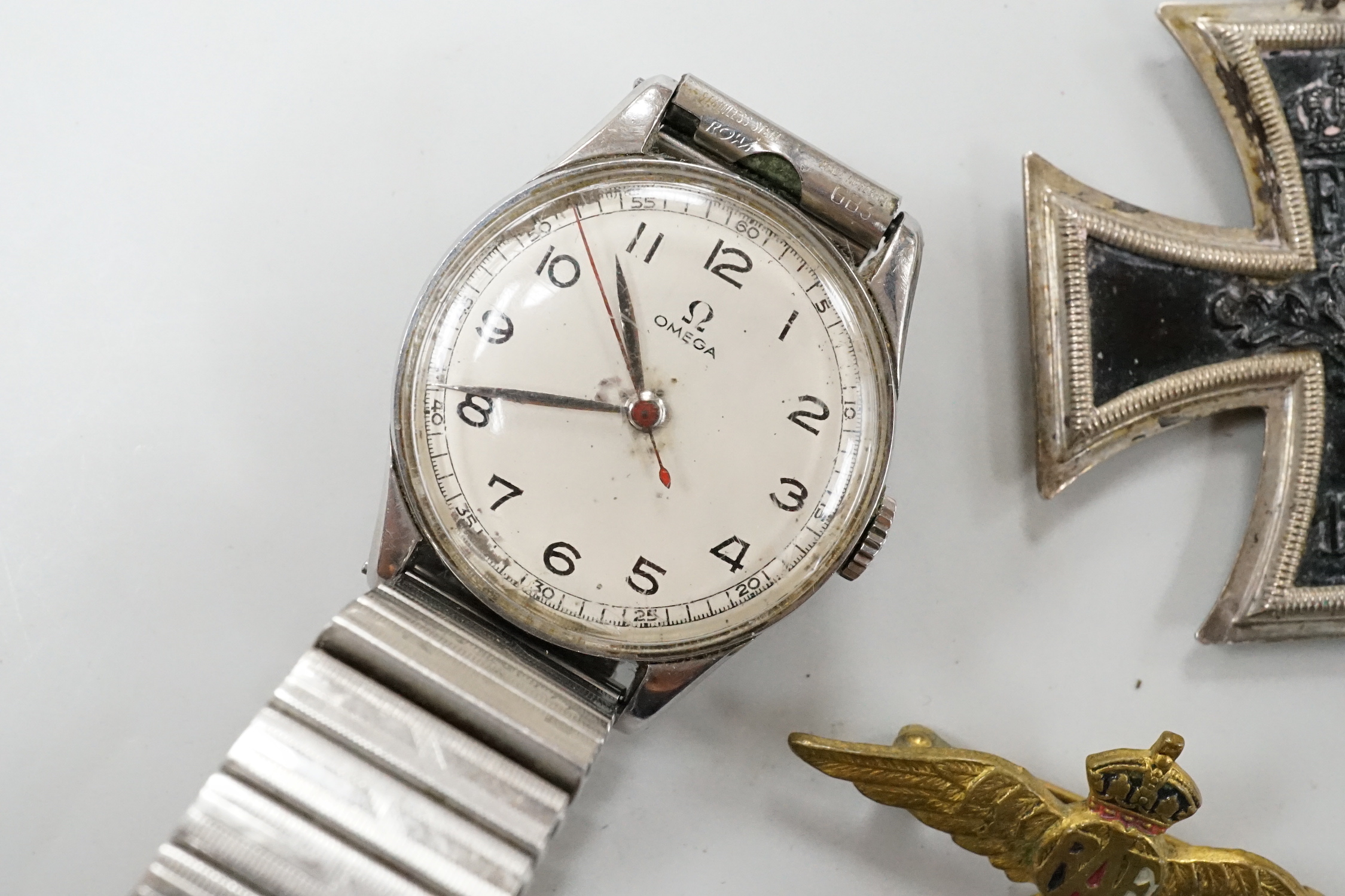 A late 1930's/ early 1940's stainless steel Omega mid-size manual wind wrist watch, serial no. 9051338. Movement c.234 SC, on associated bracelet, together with four other items.